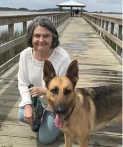 Mary Hope Roseneau on dock with her dog