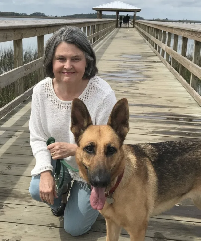 Mary Hope Roseneau on dock with her dog